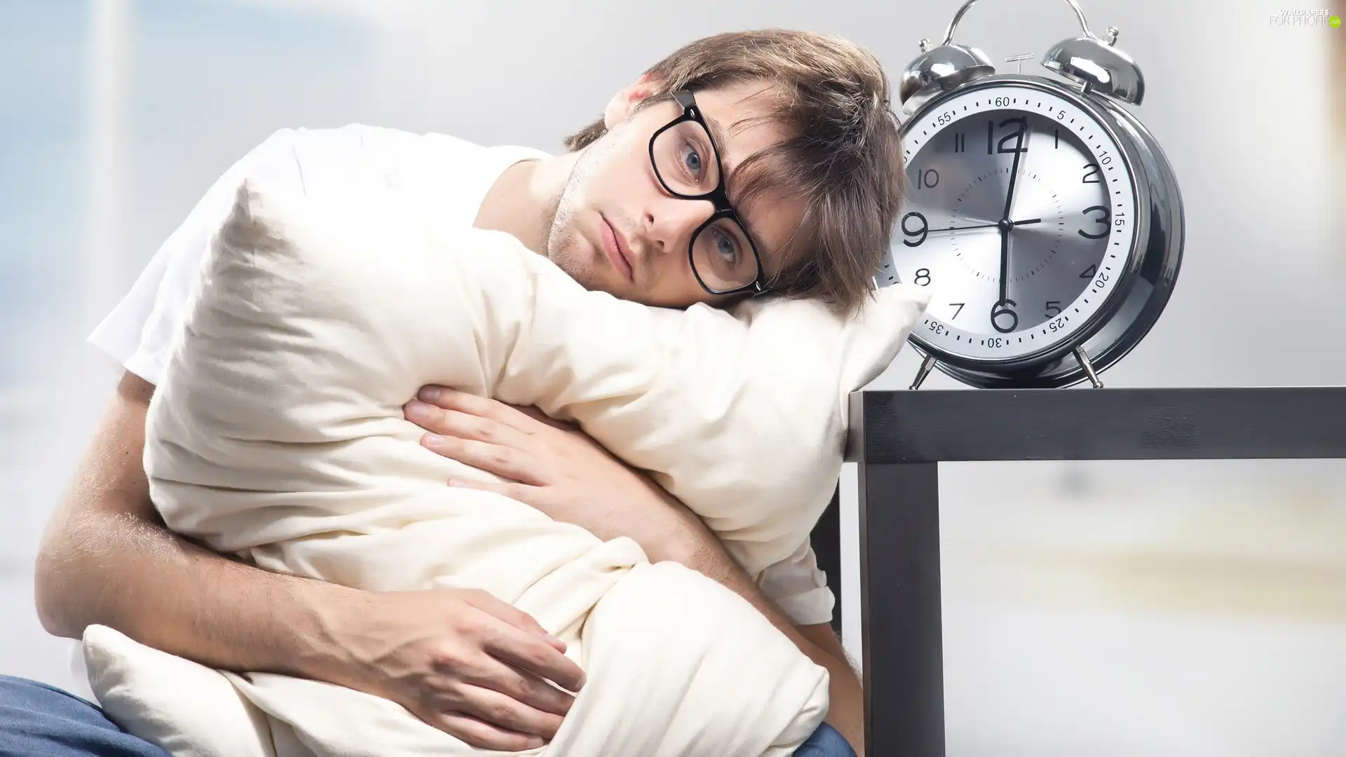 a man, alarm clock, Pillow, Glasses