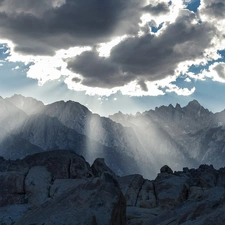 Mountains, rays of the Sun, clouds, peaks