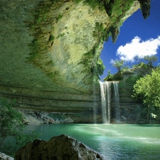 Sapling, waterfall, rocks