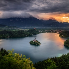 Lake Bled, Blejski Otok Island, light breaking through sky, Julian Alps Mountains, Slovenia, morning, clouds