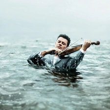 water, a man, violin