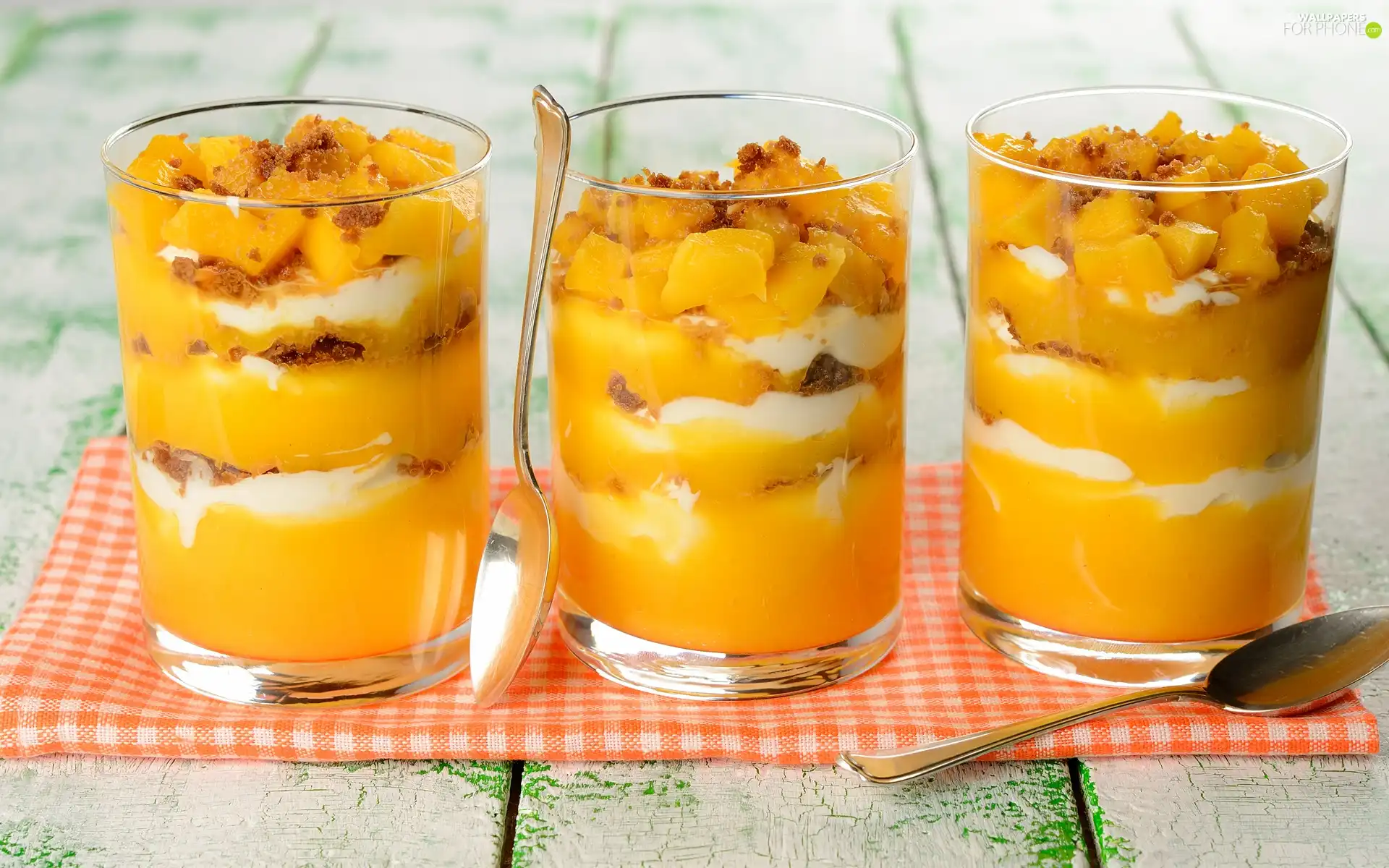 Spoons, desserts, fruit